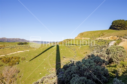 The long shadow of a single turbine at the Westwind wind farm near Wellington