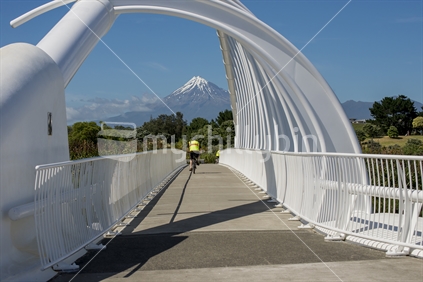 The Te Rewarewa Bridge with Cylist and Mount Taranaki on a fine summers day