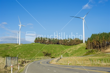 Images of wind turbines comprising some of the mills in the Te Apiti wind farm in the Tararua hills near Ashurst and Palmerston North. In this photo four tubines can be seen from the Saddle Road between Ashurst and Woodville