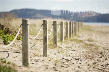 Rope fencing at an East Coast beach in New Zealand in summer (shallow depth of field)