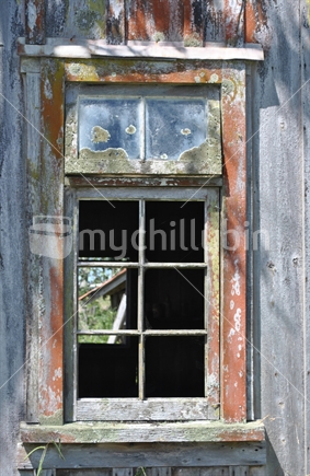 Old derelict home window.