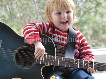 A child playing guitar