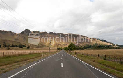 Unstable ground on Waimarama Road, Havelock North, Hawke's Bay (Te Mata Peak in the background).