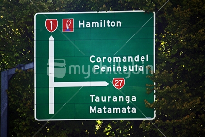 Road sign indicating Hamilton, Coromadel, Tauranga, Matamata, destinations. 