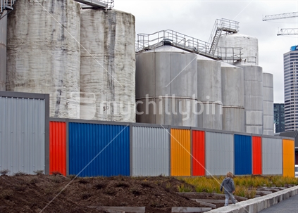 Child walking past the silos at the new Viaduct Harbour Park, Auckland, New Zealand. 