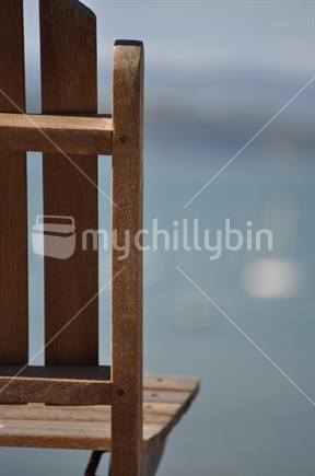 Empty chair overlooking a New Zealand bay