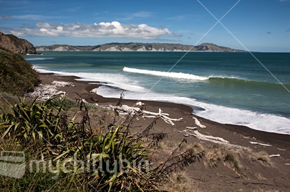 The waves roll in at a remote beach on the Mahia Peninsula, a favourtie spot with surfers.