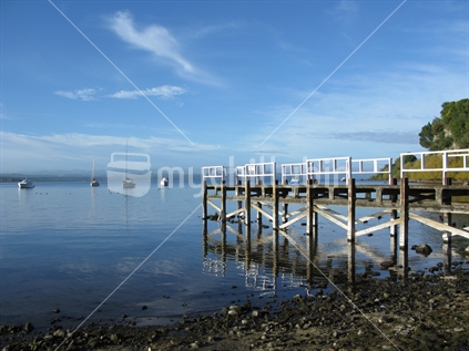 Te Moenga Bay jetty at side, with boats, Lake Taupo