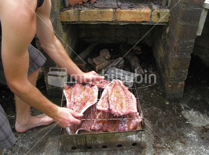 Prepared raw New Zealand Kawhai fish in smoker