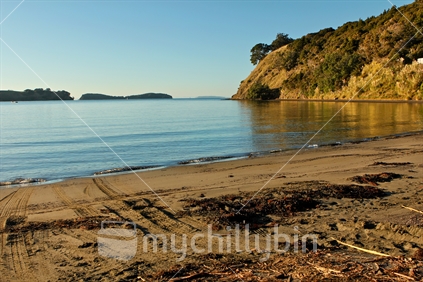 Boat launch ramp is across the beach - Mahurangi, New Zealand.