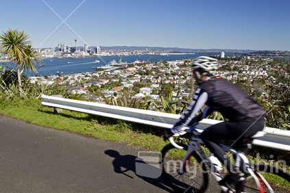 Male biker moving overlooking Auckland from Mt Victoria in Devonport