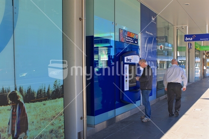 Shopping centres of Auckland - street views series: Newmarket.  Using an ATM.