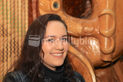 A female Maori university student - background cultural design