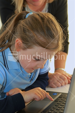 Girl school student working on a computer