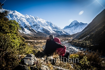 Mount Cook Tourists Enjoying the Sun and Stunning Alpine View