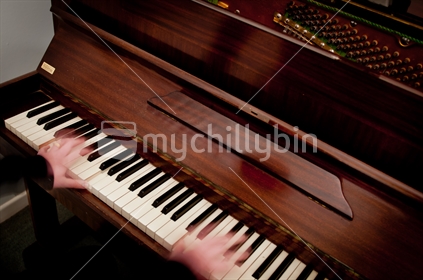 Blurred hands playing piano