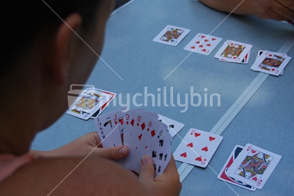Cards on a camp table