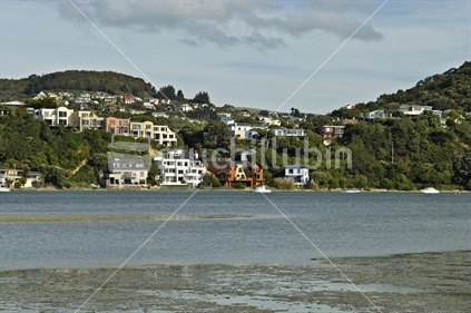 Houses in varied styles, on the southern side of Paremata Harbour, Wellington, New Zealand