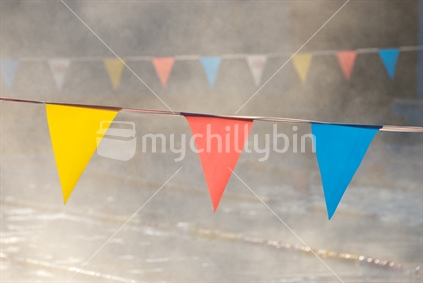 Lane flags in steamy swimming pool