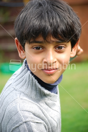 Indian boy, in New Zeland backyard.