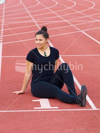 Young Maori woman on athletics track