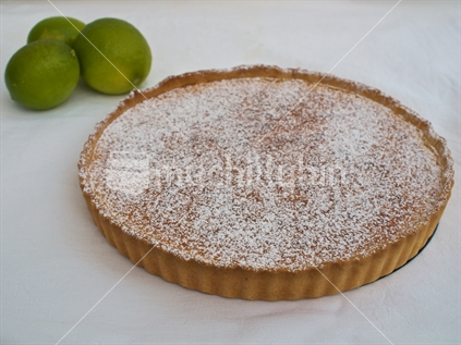 A home made lime tart, with limes