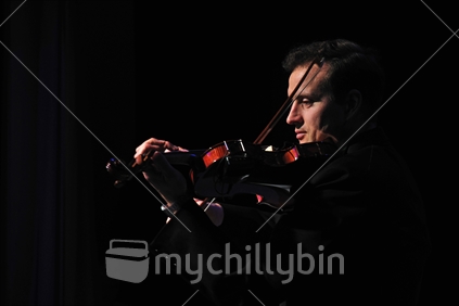 Violinist performing in live concert