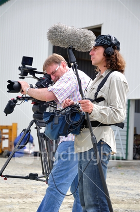 Cameraman and sound recordist at work