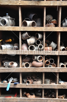 Background shot of pipe fittings in their shelves