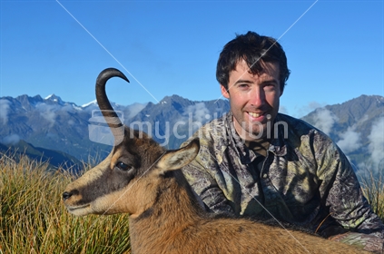 Hunter posing with Chamois buck shot in the high country, South Westland
