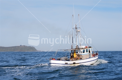 Fishing vessel heading out near Nelson, South Island, New Zealand.