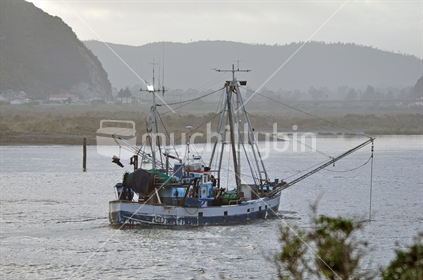 Fishing vessel entering the Grey River, Greymouth, West Coast