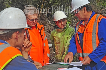 Geologists in the field discuss the results of a seismic reflection survey