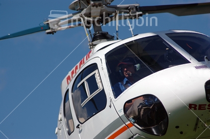 Pilot of the local Rescue Helicopter prepares to land near Greymouth, Westland