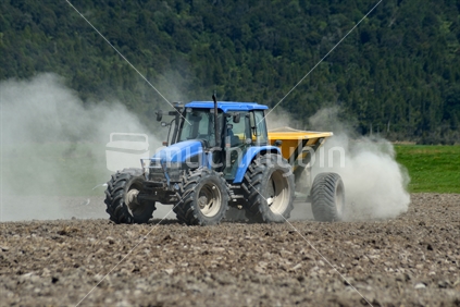 Farmer spreads lime on a West Coast paddock ready for sowing new pasture