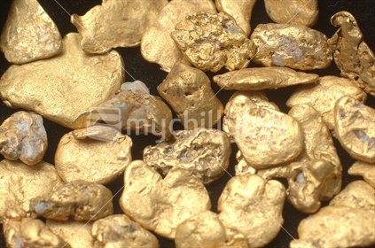 Full frame shot of small gold nuggets from Grey River Gold Dredge, West Coast, South Island, New Zealand