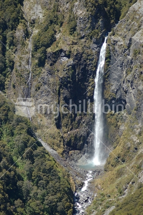 Aerial of an unknown alpine waterfall near Arthurs Pass National Park, West Coast, South Island
