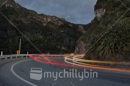Time exposure of traffic on coast road, north of Greymouth, West Coast, South Island, New Zealand