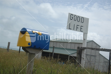 Farm displaying signage for the Good Life, West Coast, South Island