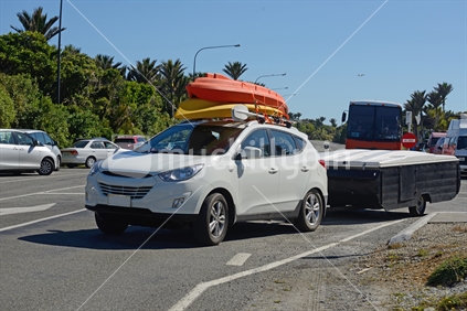 A holiday vehicle leaving the Punakaiki tourist centre on their tour of the South Island, New Zealand. The Pancake Rocks attract more than 100,000 visitors a year.