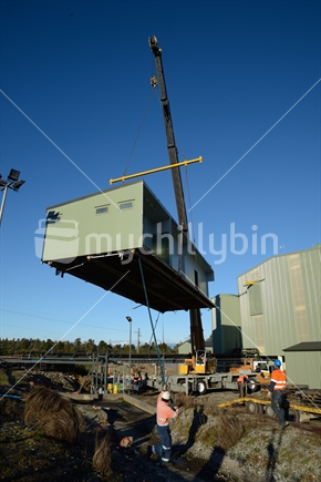 A crane lifts a building at the  Pike River Coal mine on June 22, 2015 near Greymouth, New Zealand, after the mine assets were sold up. 29 miners died at the mine in 2010 and it cannot be reopened.