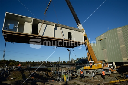 A crane lifts a building at the  Pike River Coal mine on June 22, 2015 near Greymouth, New Zealand, after the mine assets were sold up. 29 miners died at the mine in 2010 and it cannot be reopened.