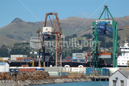 Cranes unloading shipping containers at Port of Lyttleton, South Island, New Zealand. (movement bottom left)