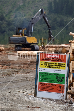 Safety signage warns of the dangers at a logging site on the West Coast