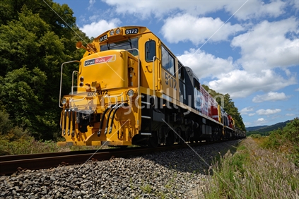 A freight train carries a load of gold ore from Reefton to Otago for processing