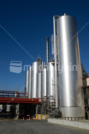 Storage tanks or silos at the Westland Milk Products factory  in Hokitika, New Zealand ready for deliveries of fresh milk.