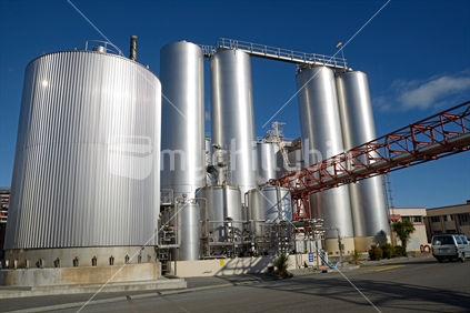 HOKITIKA, NEW ZEALAND, 27 JUNE, 2016: Storage silos at the Westland Milk Products factory  in Hokitika, New Zealand ready for deliveries of fresh milk.