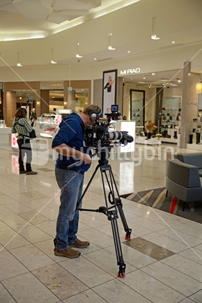 Film crew at work in a large shopping mall in Christchurch