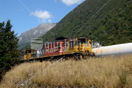 A freight train waits to depart from the Otira Railway Station