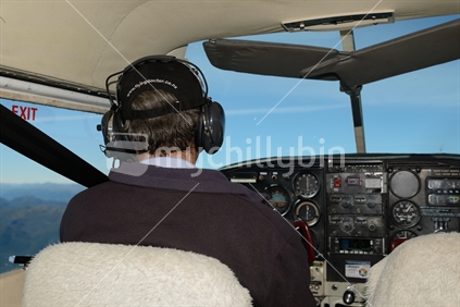 A pilot working for the flying doctor service flies over the West Coast on a weekly trip to Karamea